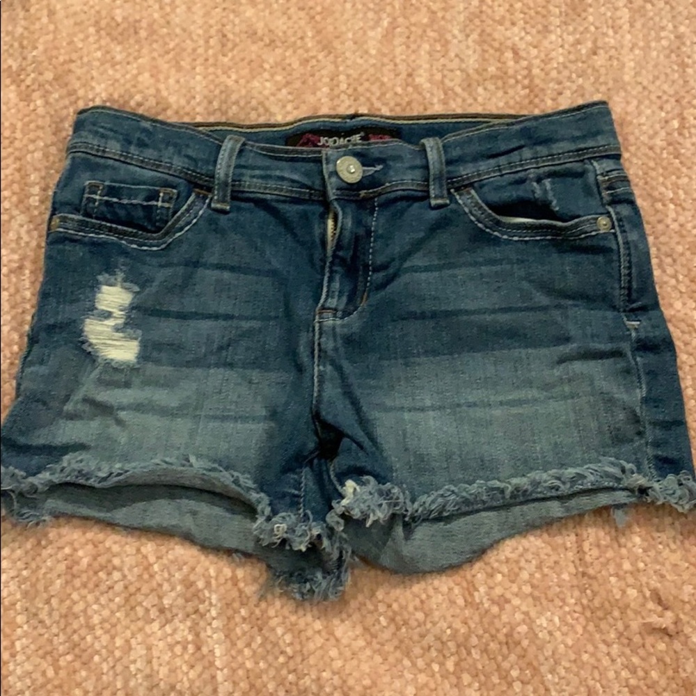 Jean shorts with rips in the legs